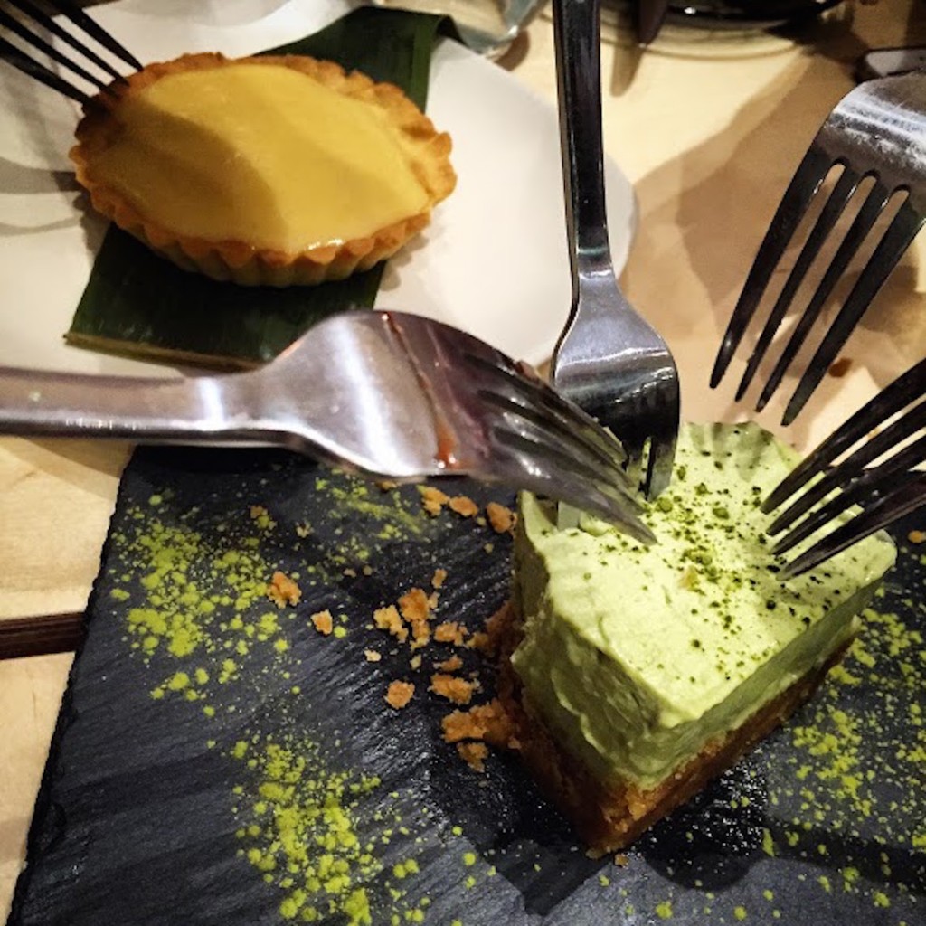 Bloody war over a piece of Green Tea Cheesecake (a delicious Yuzu tart in the background) #sweettooth