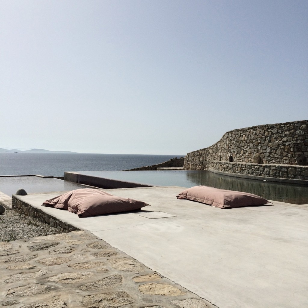 Bohemian-chic setting around the pool at a private residence in Mykonos.