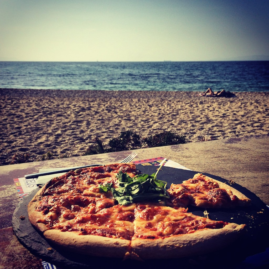 Pizza margherita on Alimos beach on a sunny November day