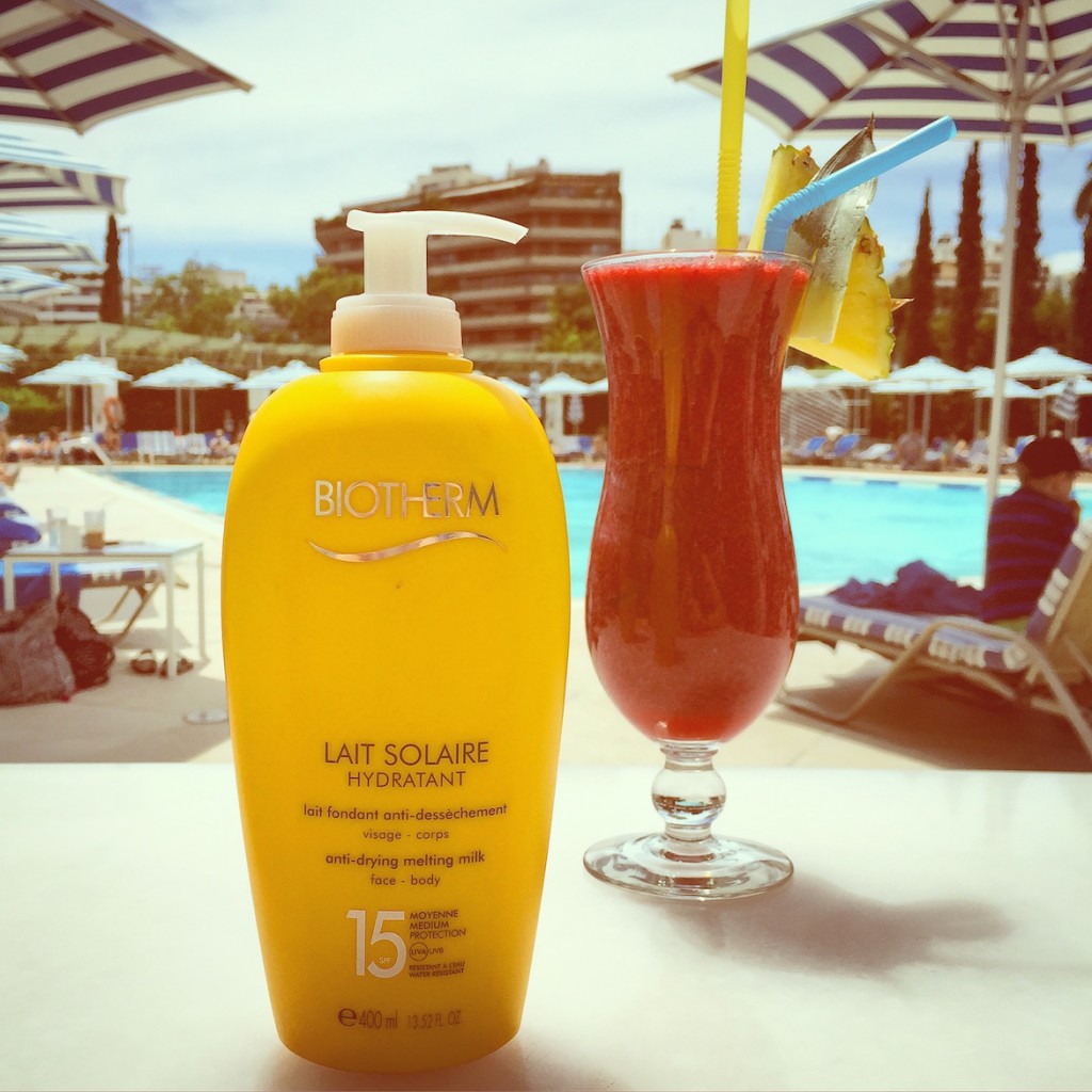 Giant's size BIOTHERM lait solaire hydradant SPF15 smelling like orange blossoms...