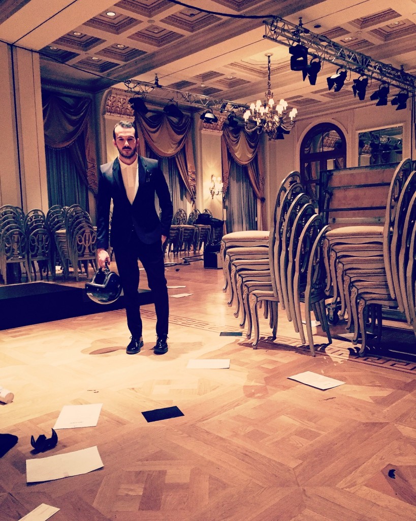 After the show wearing suit by Maison Martin Margiela, polo shirt by Lacoste & black patent shoes by Hogan Rebel.