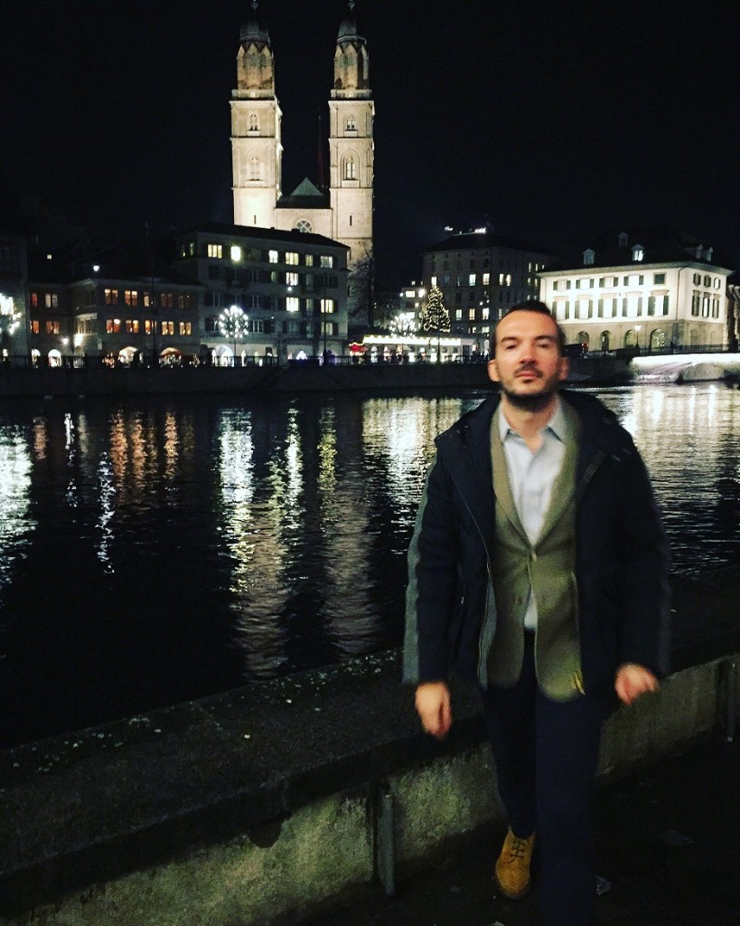 An impressive view of the old city of Zurich at night.
