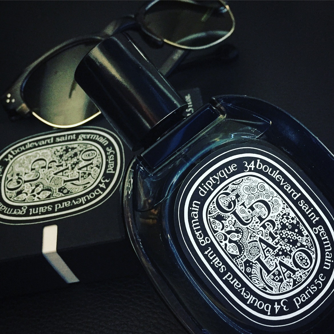 The elegant precious bottle of Oud Palao eau de parfum // sunglasses by Hally & Son (Bairamoglou).