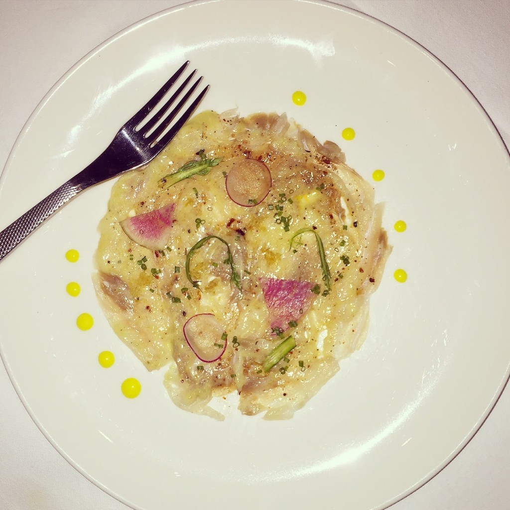 A fine sea bass carpaccio with citrus fruit zest, lemon-mango condiment!